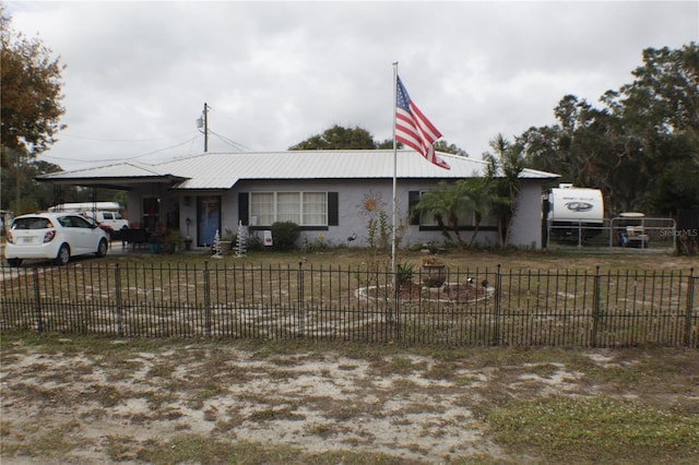 single story home featuring a carport