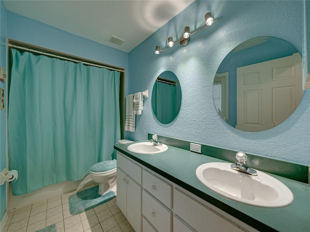 full bathroom featuring tile patterned flooring, vanity, toilet, and shower / bath combo