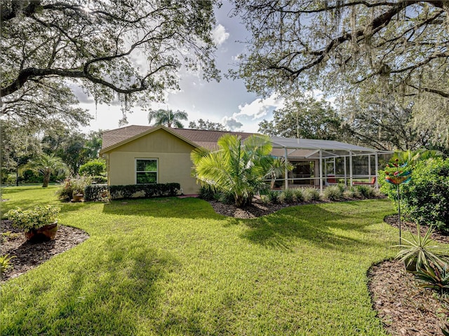 1072 Old Cutler Rd, Lake Wales, FL 33898 - back of house featuring a lawn and glass enclosure
