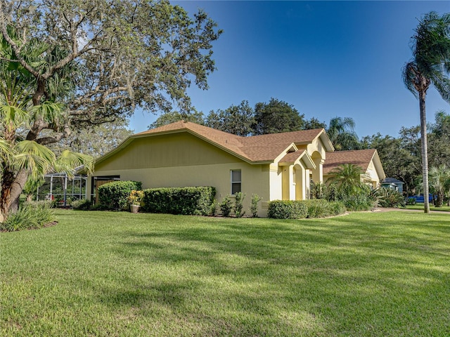 view of property exterior with a yard