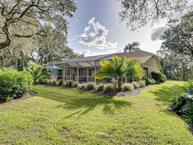 1072 Old Cutler Rd, Lake Wales, FL 33898 - rear view of property featuring a yard and glass enclosure