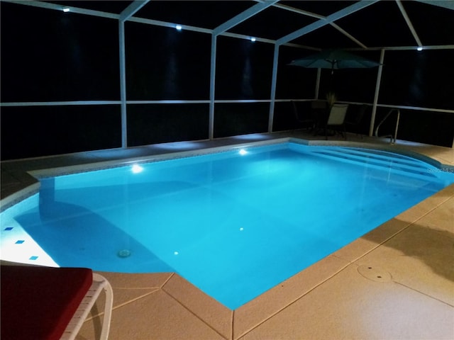 view of pool featuring a lanai