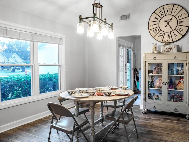 dining area featuring dark hardwood / wood-style flooring and lofted ceiling