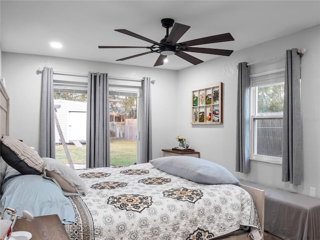 bedroom with access to outside and ceiling fan