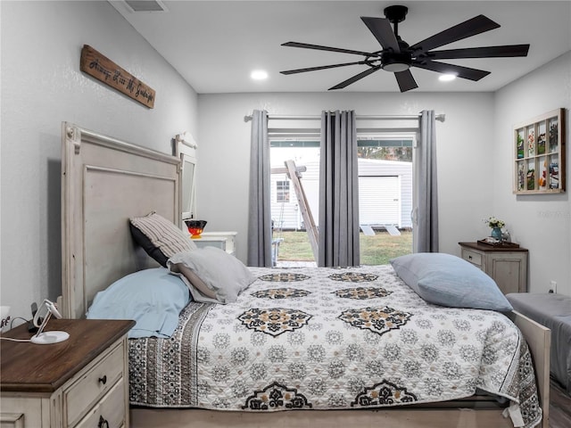 bedroom with ceiling fan and hardwood / wood-style floors