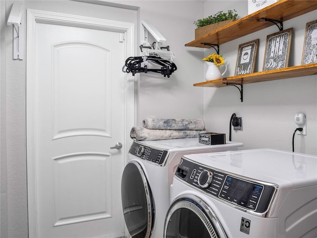 laundry room with washing machine and dryer