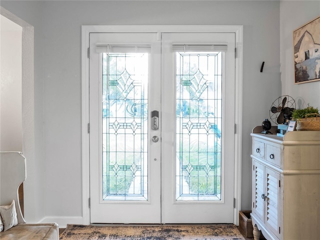 entryway featuring a wealth of natural light and french doors