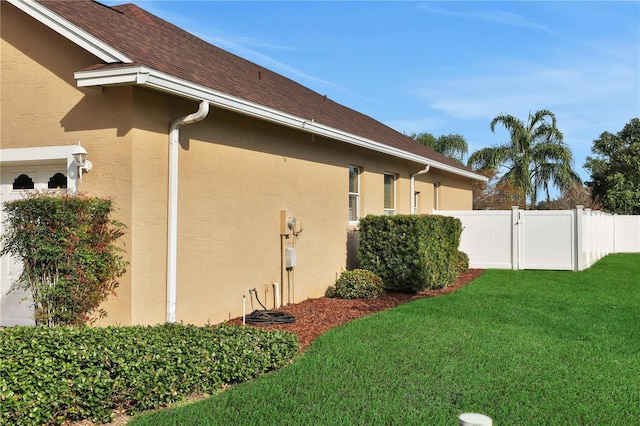 view of property exterior with a lawn