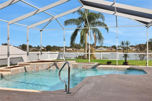 view of pool featuring glass enclosure