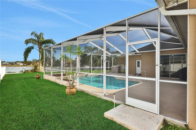 view of pool featuring a lanai, a yard, and a patio