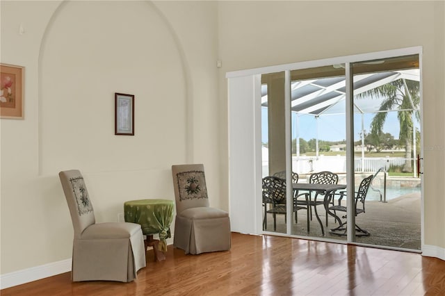 sitting room with hardwood / wood-style flooring