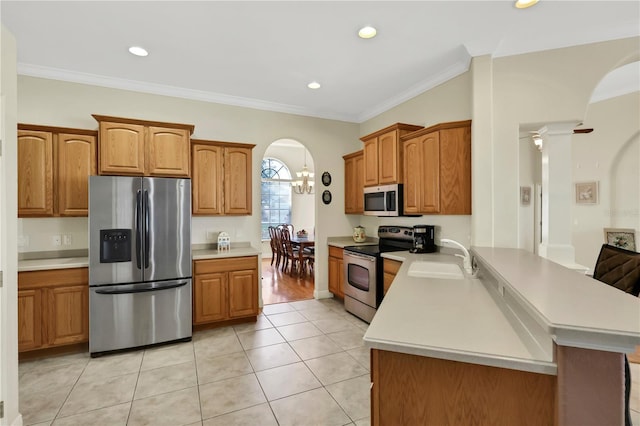 kitchen featuring kitchen peninsula, ornamental molding, stainless steel appliances, sink, and light tile patterned floors