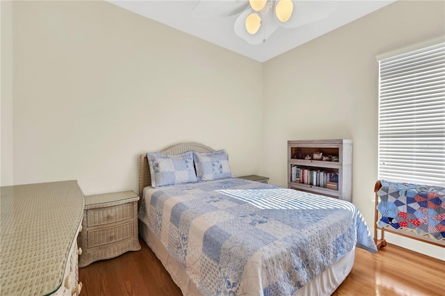 bedroom featuring ceiling fan and wood-type flooring