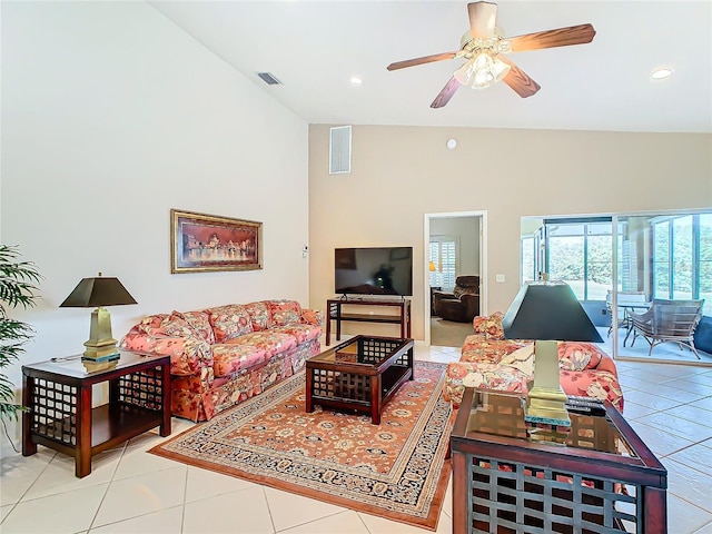 living room with light tile patterned floors, high vaulted ceiling, and ceiling fan