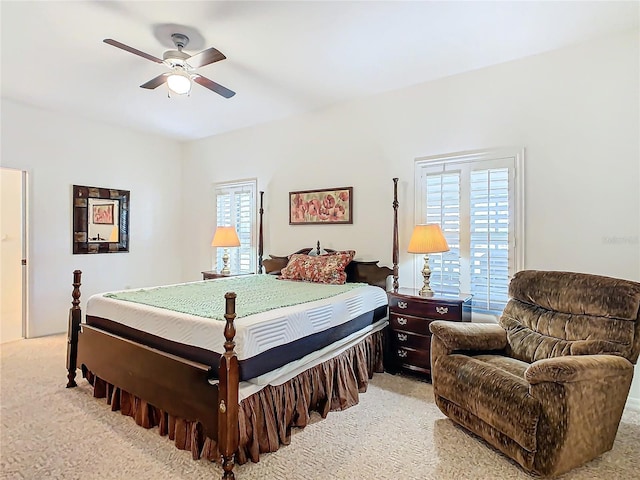 bedroom with light colored carpet and ceiling fan