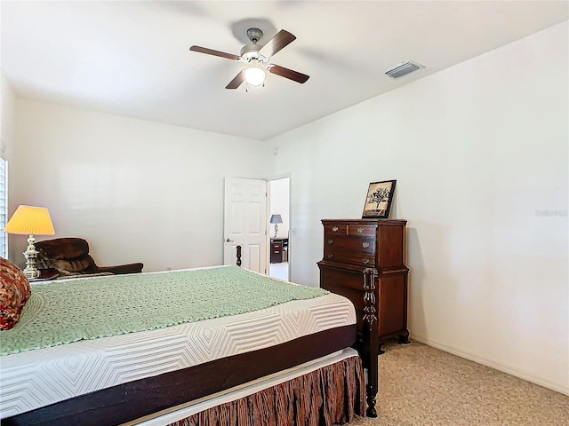 bedroom with ceiling fan and light carpet