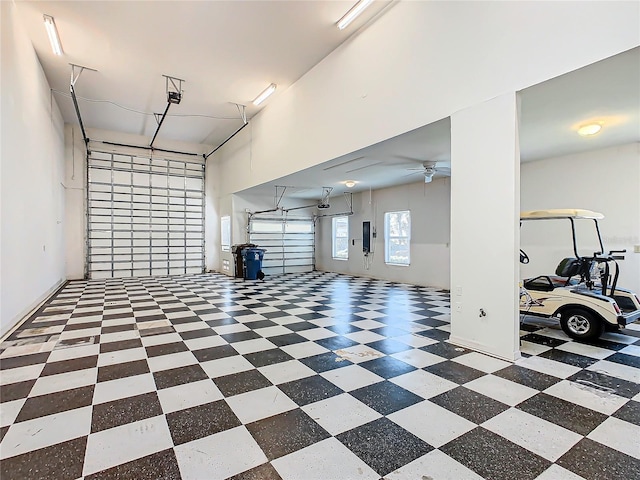 garage featuring electric panel and ceiling fan