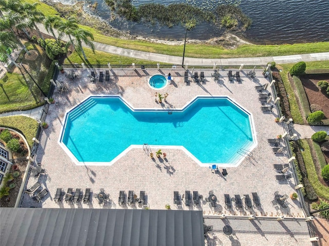 view of pool with a water view