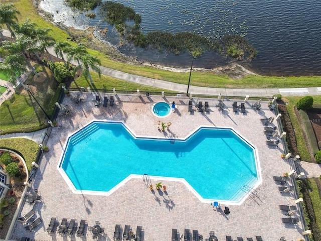 view of swimming pool with a water view