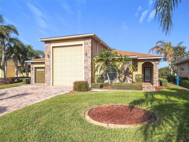 view of front of house featuring a garage and a front lawn