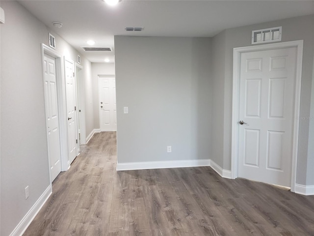 empty room featuring hardwood / wood-style flooring