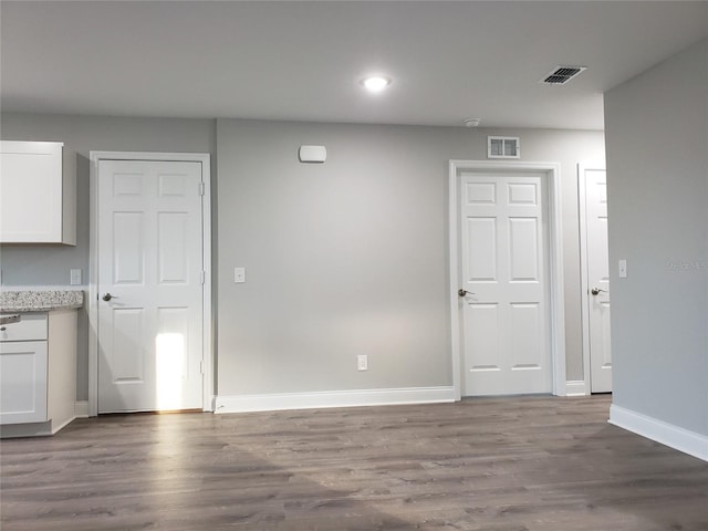 spare room featuring hardwood / wood-style flooring