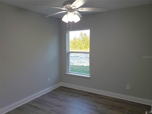 unfurnished room with ceiling fan, plenty of natural light, and dark hardwood / wood-style floors