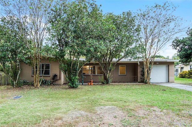 1891 18th St NW, Winter Haven, FL 33881 - view of front of property featuring a garage, a front yard, and concrete driveway