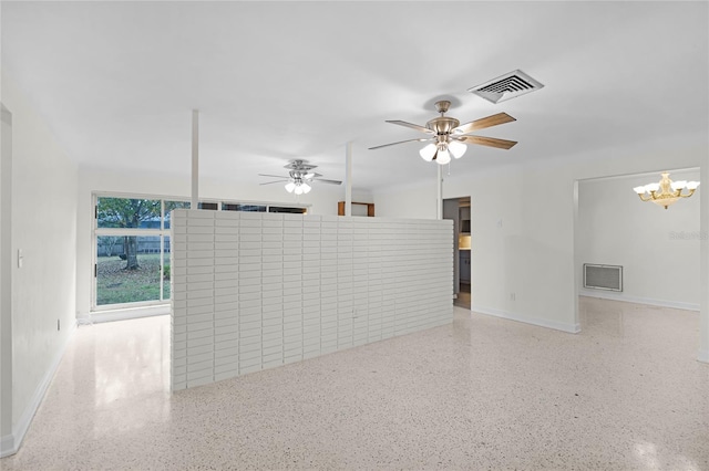1891 18th St NW, Winter Haven, FL 33881 - unfurnished living room featuring speckled floor, a chandelier, and ceiling fan