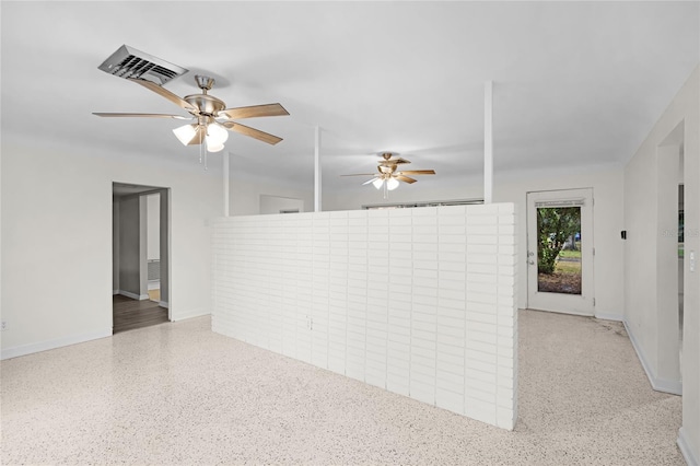 1891 18th St NW, Winter Haven, FL 33881 - spare room featuring a ceiling fan and dark aggregate flooring