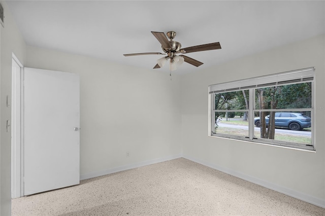 spare room featuring ceiling fan