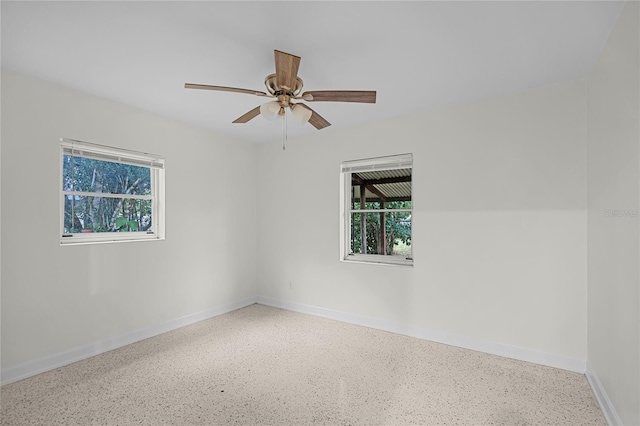 1891 18th St NW, Winter Haven, FL 33881 - spare room featuring speckled floor, healthy amount of natural light, and ceiling fan