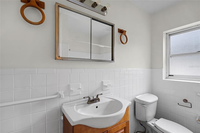 1891 18th St NW, Winter Haven, FL 33881 - bathroom with vanity, tile walls, and a wainscoted wall