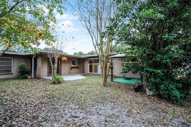 1891 18th St NW, Winter Haven, FL 33881 - back of house with a patio