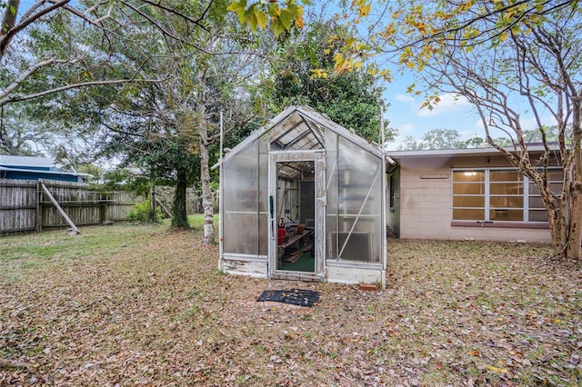 1891 18th St NW, Winter Haven, FL 33881 - view of greenhouse with a fenced backyard