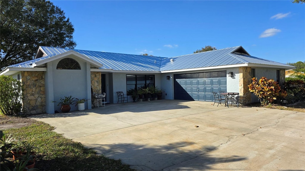 ranch-style home featuring a garage