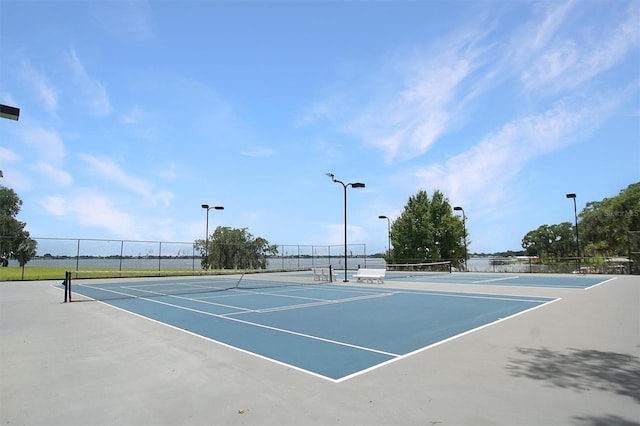 view of sport court featuring basketball hoop