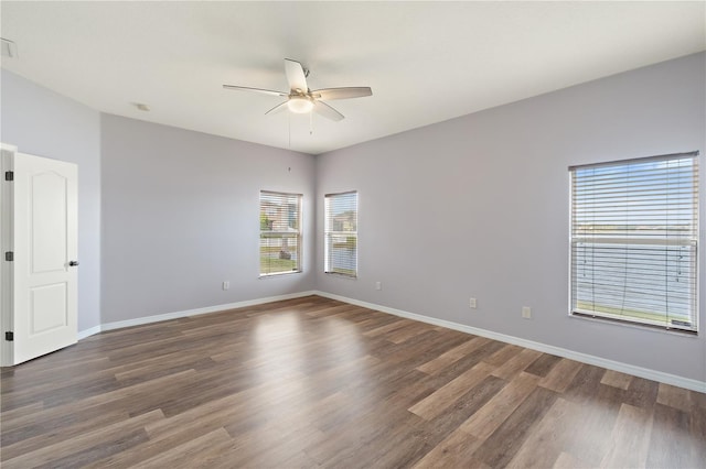 unfurnished room featuring ceiling fan and dark hardwood / wood-style flooring