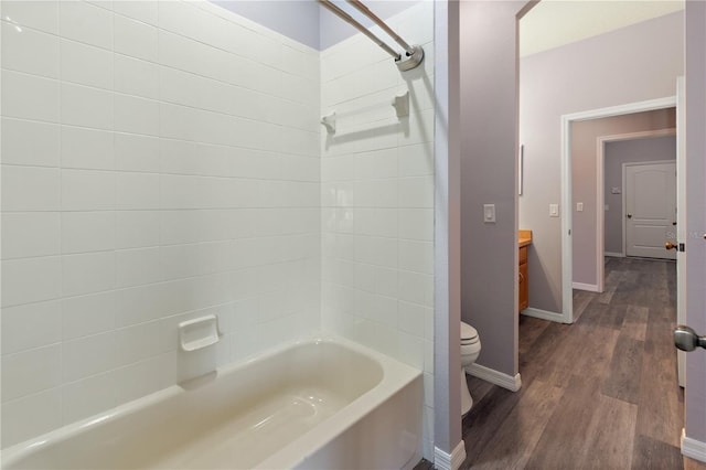 full bathroom with shower / bath combination, vanity, wood-type flooring, and toilet