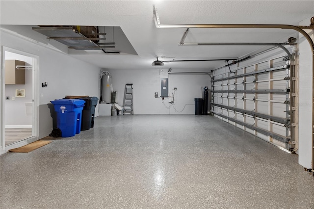 garage featuring a garage door opener, electric panel, and water heater