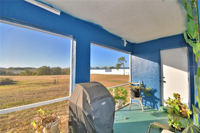 sunroom with a rural view