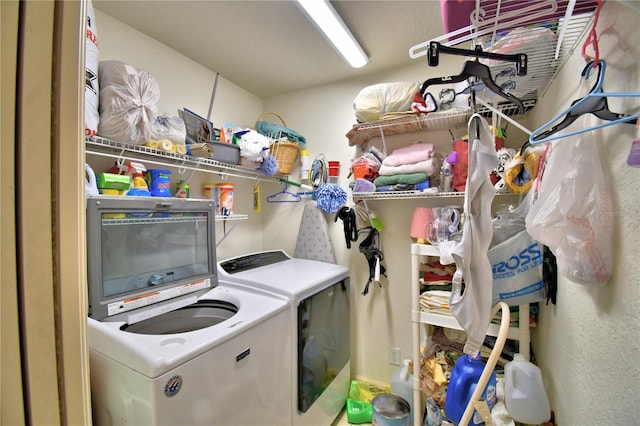 laundry area with washing machine and clothes dryer