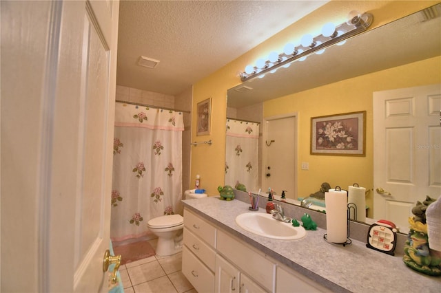 bathroom with vanity, a textured ceiling, tile patterned flooring, toilet, and curtained shower