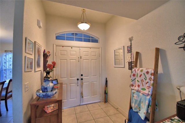 entrance foyer featuring light tile patterned floors