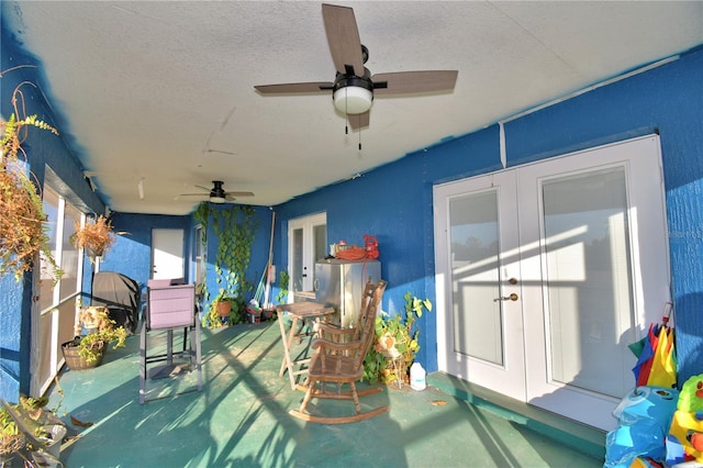 view of patio featuring ceiling fan and french doors