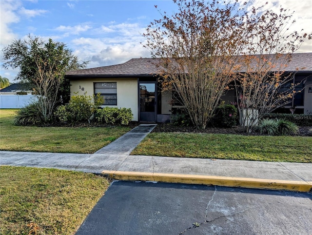 ranch-style house with a front yard