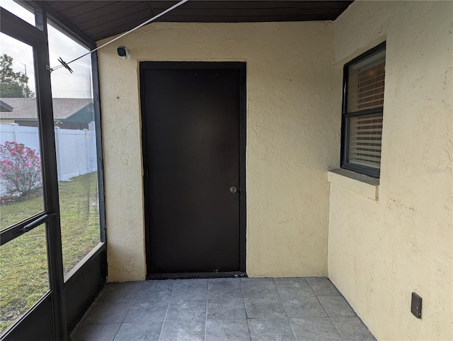 doorway to property with stucco siding