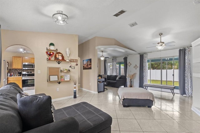 living room with light tile patterned flooring and a textured ceiling