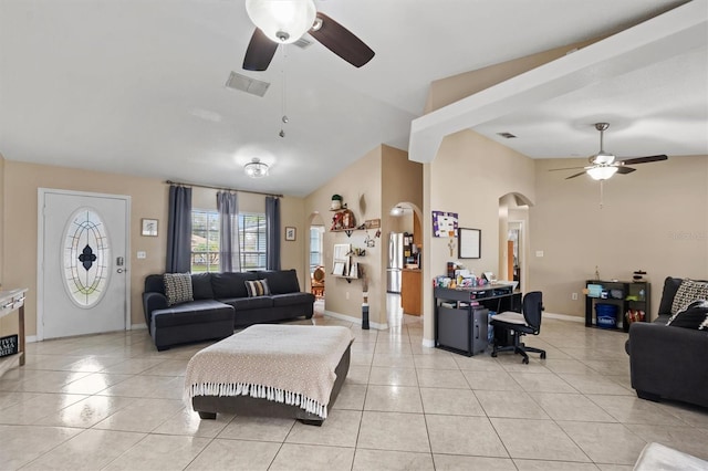 living room with light tile patterned floors, vaulted ceiling, and ceiling fan