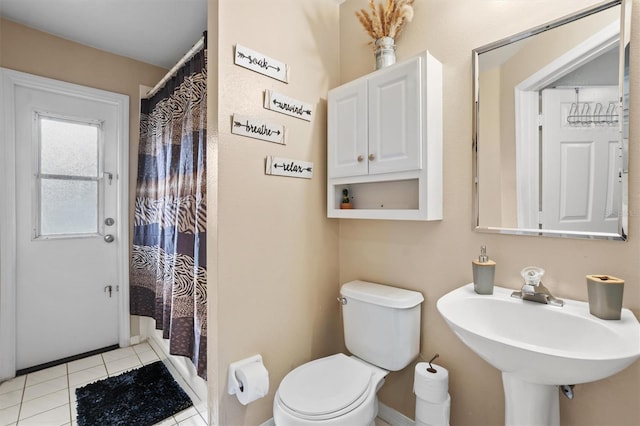 bathroom featuring tile patterned floors, sink, and toilet